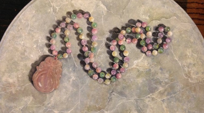 Quartz Beads on Faux Grey Marble Pedestal Table