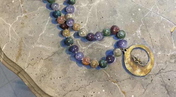 Man in the Moon Beads on Faux Marble table